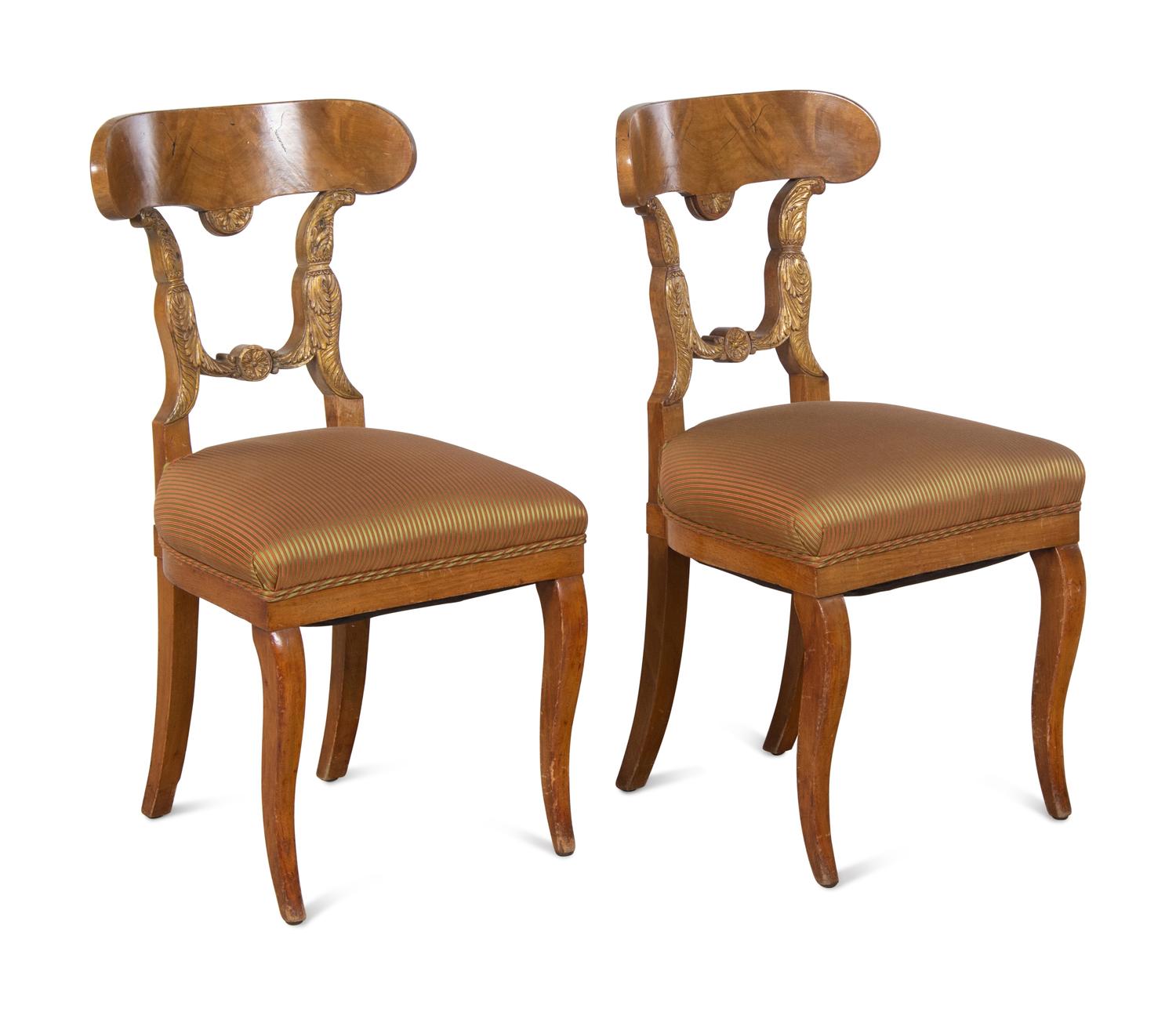 A Pair of Biedermeier Parcel-Gilt Birch Side Chairs