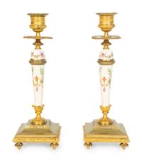 A Pair of French Gilt Bronze and Painted Porcelain Candlesticks