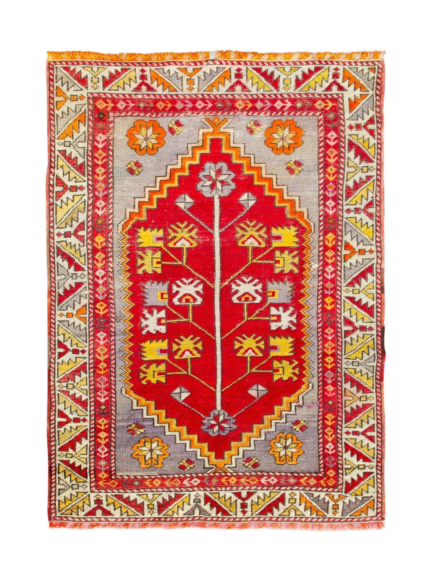 A Caucasian Wool Rug — 20TH CENTURY