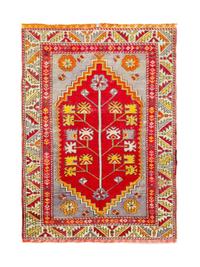 A Caucasian Wool Rug — 20TH CENTURY