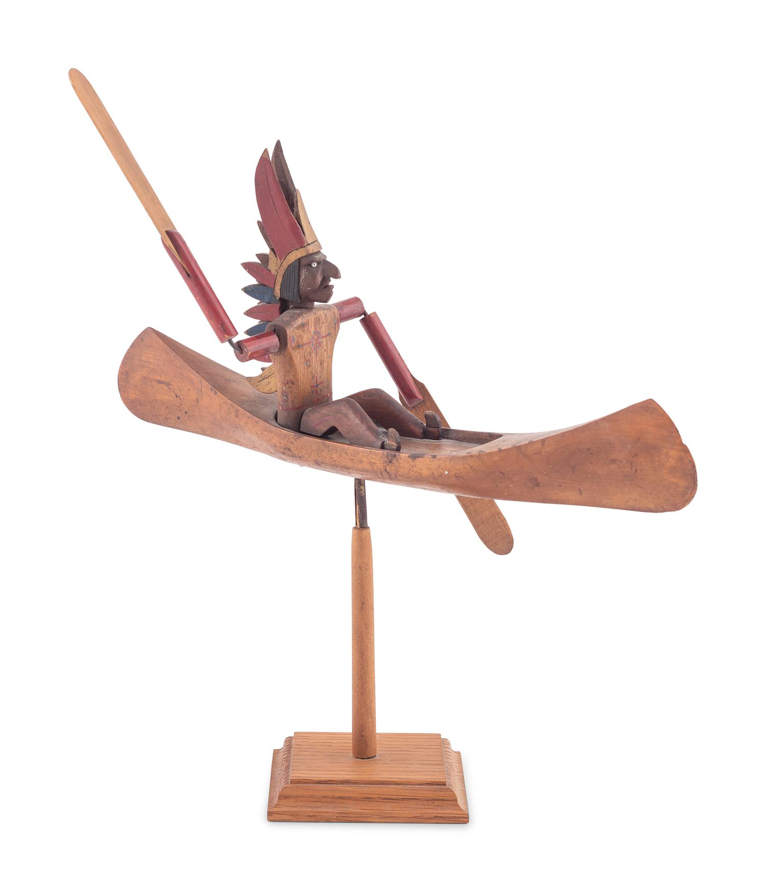 A Folk Art Whirligig of an American Indian in a Canoe