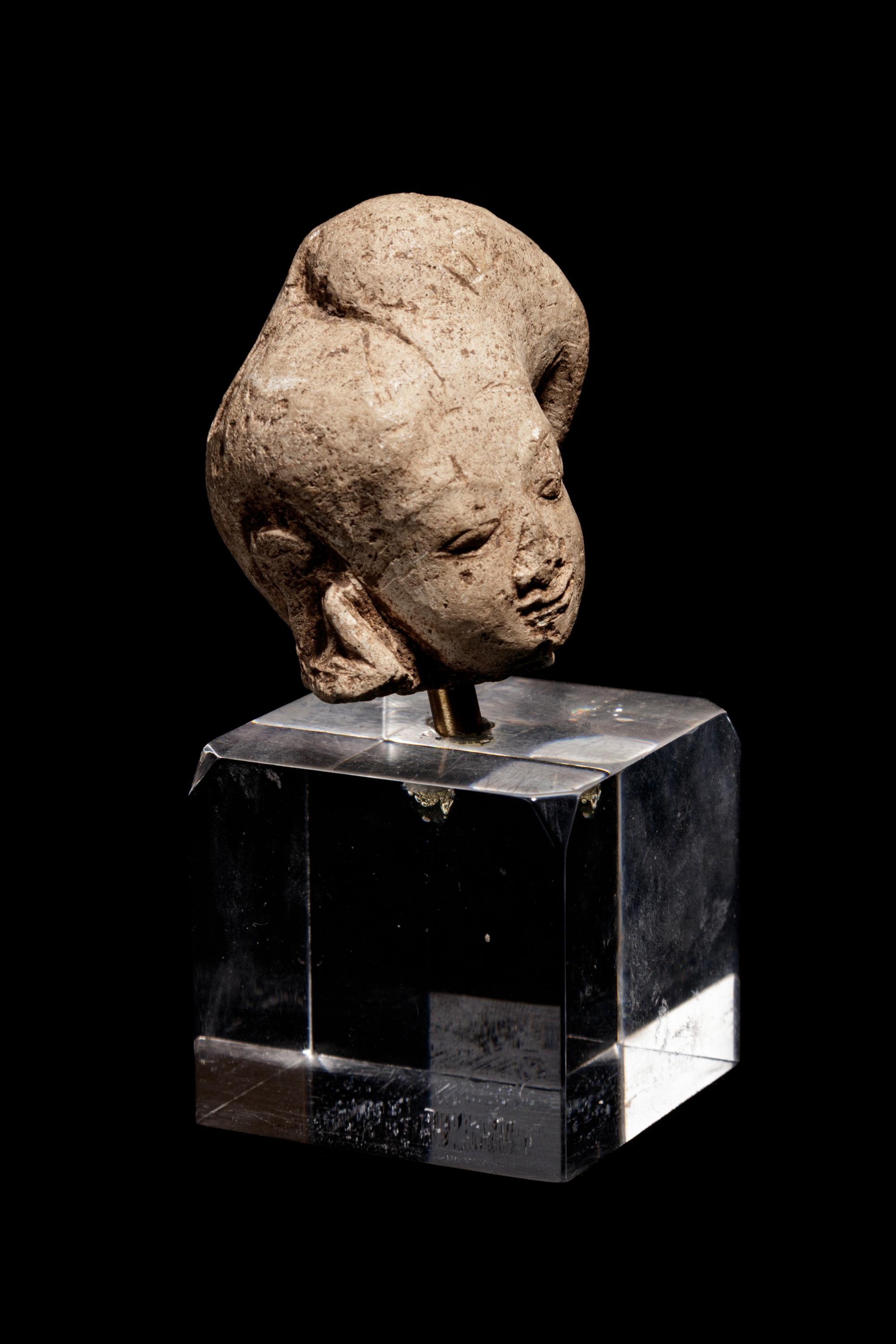 An Egyptian Terracotta Head of Harpokrates