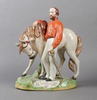 A Staffordshire Figural Group, Height 14 1/5 inches.
