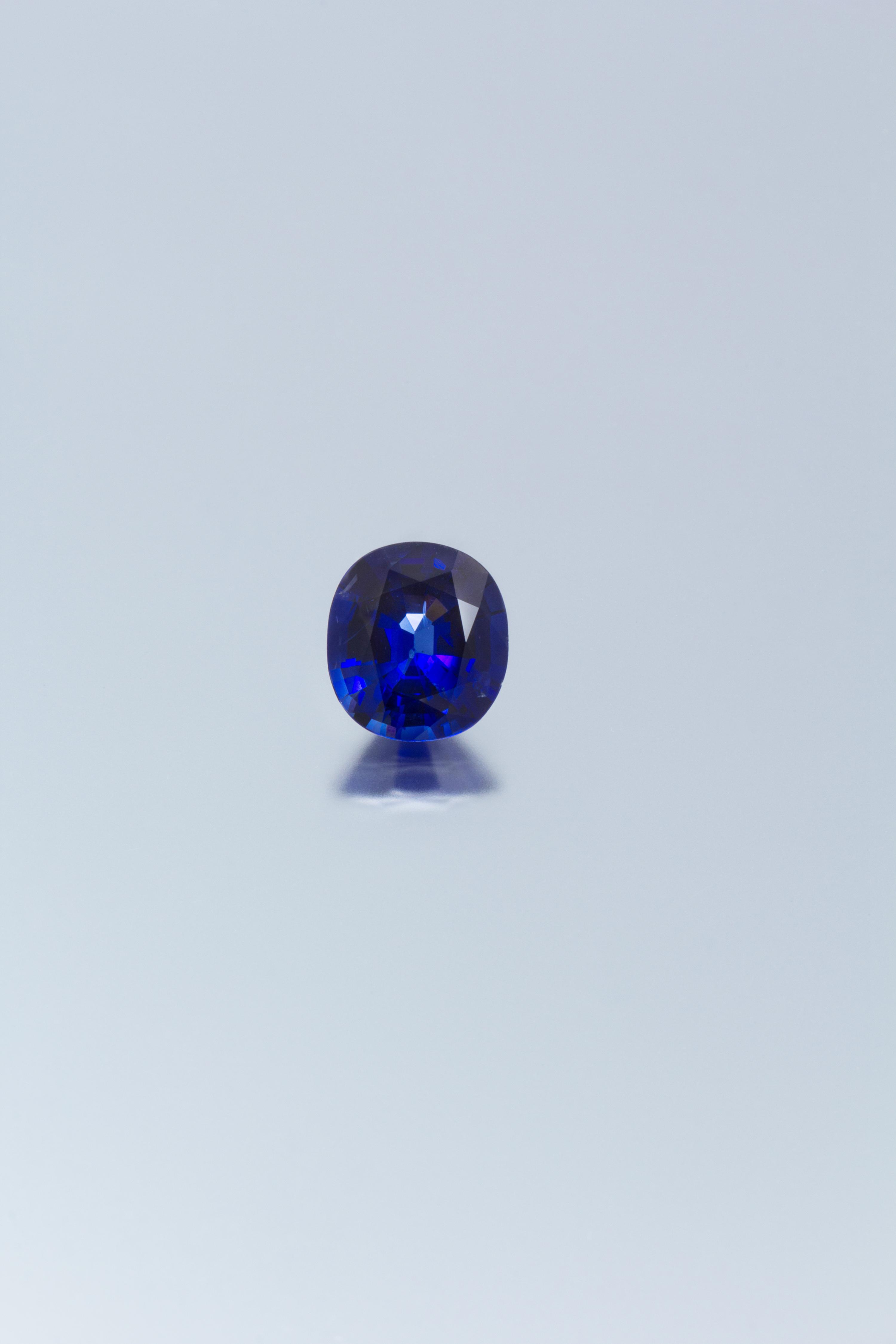 A 6.14 Carat Antique Cushion Cut Sapphire,