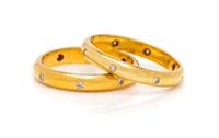 A Pair of Yellow Gold and Diamond Rings,