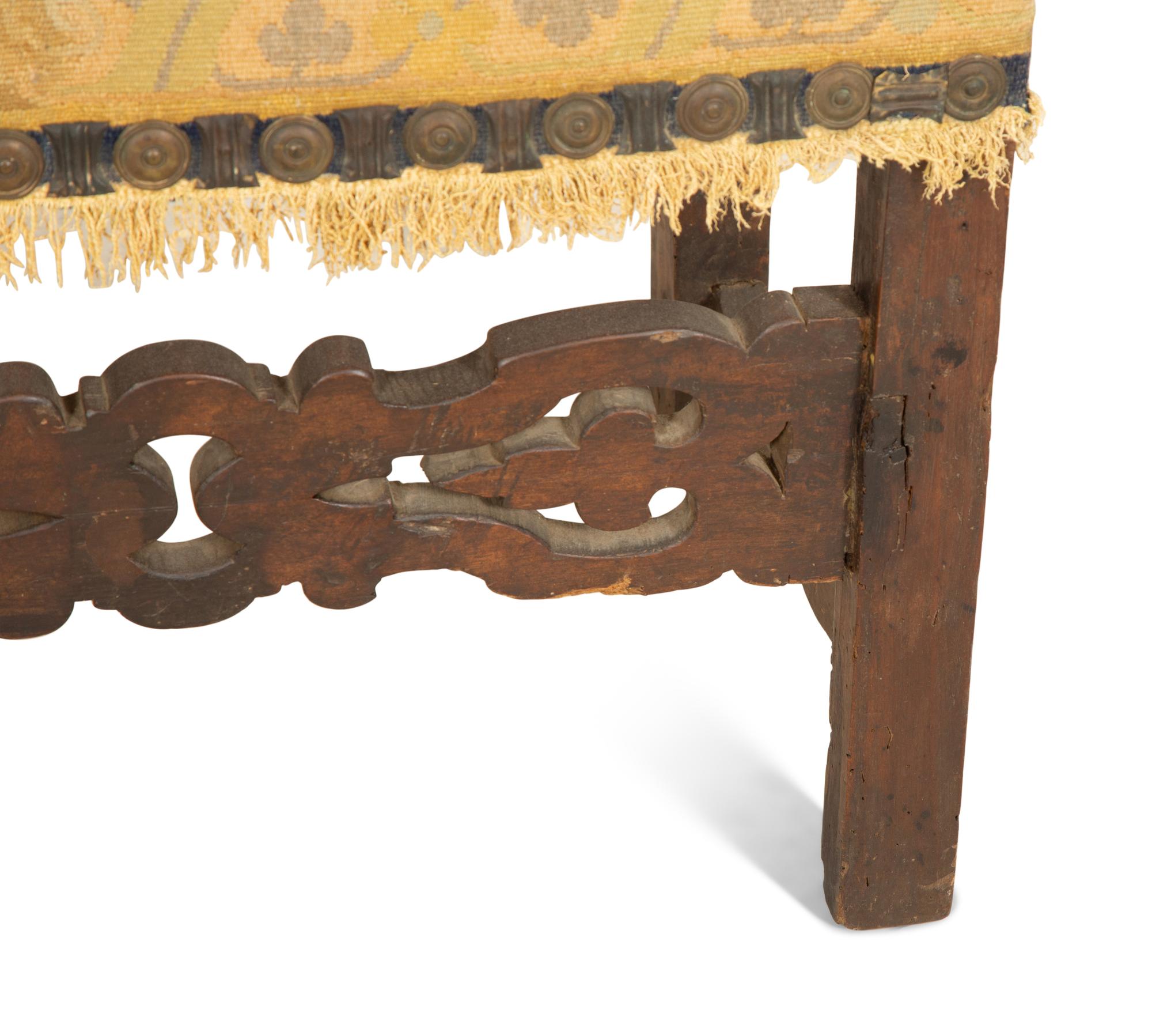 A Jacobean Style Walnut Bench with Tapestry Upholstery