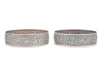 A Pair of Sterling Silver Floral Repousse Wine Coasters, Tiffany & Co., New York, NY, Circa 1880