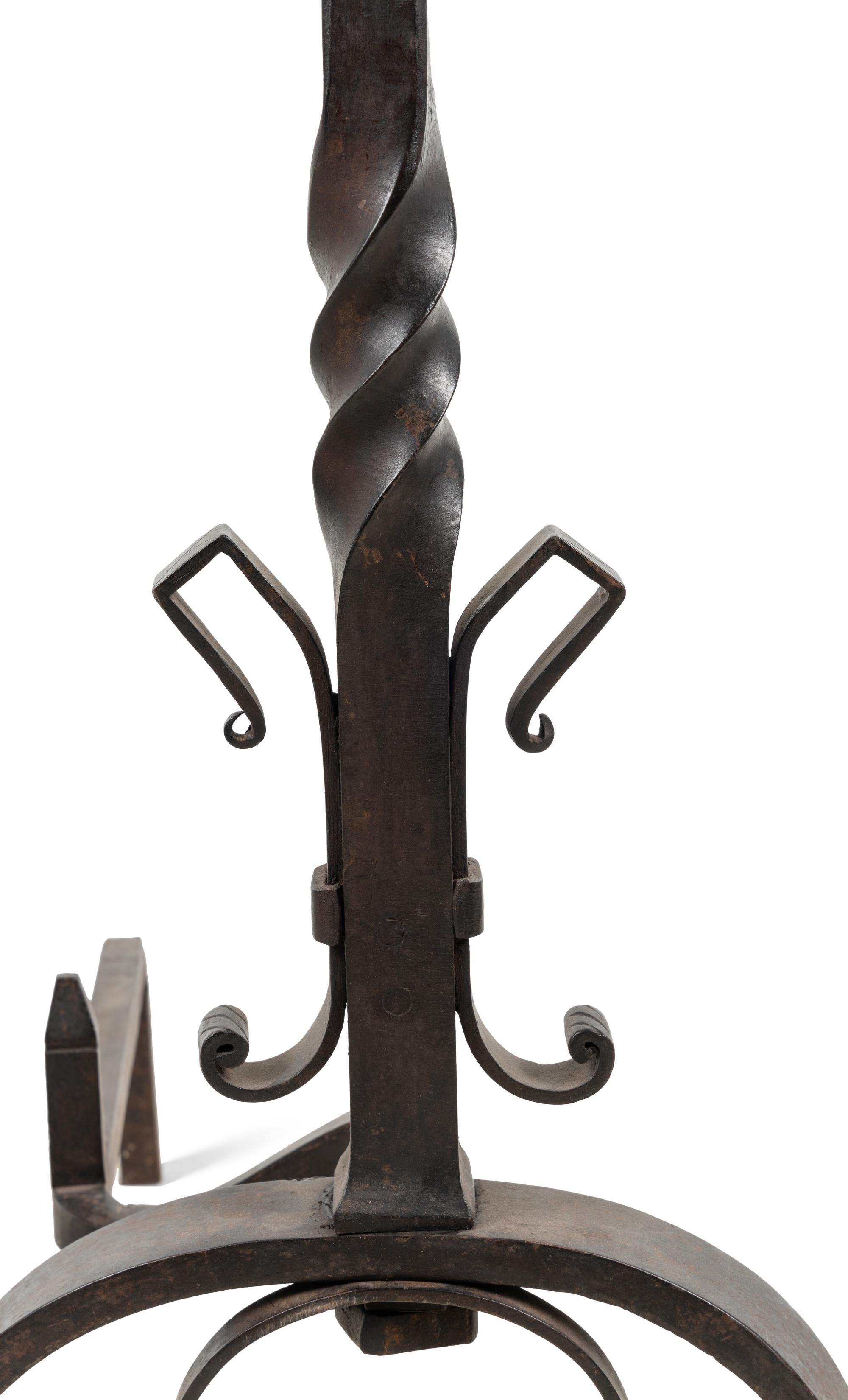 A Pair of Continental Iron Andirons