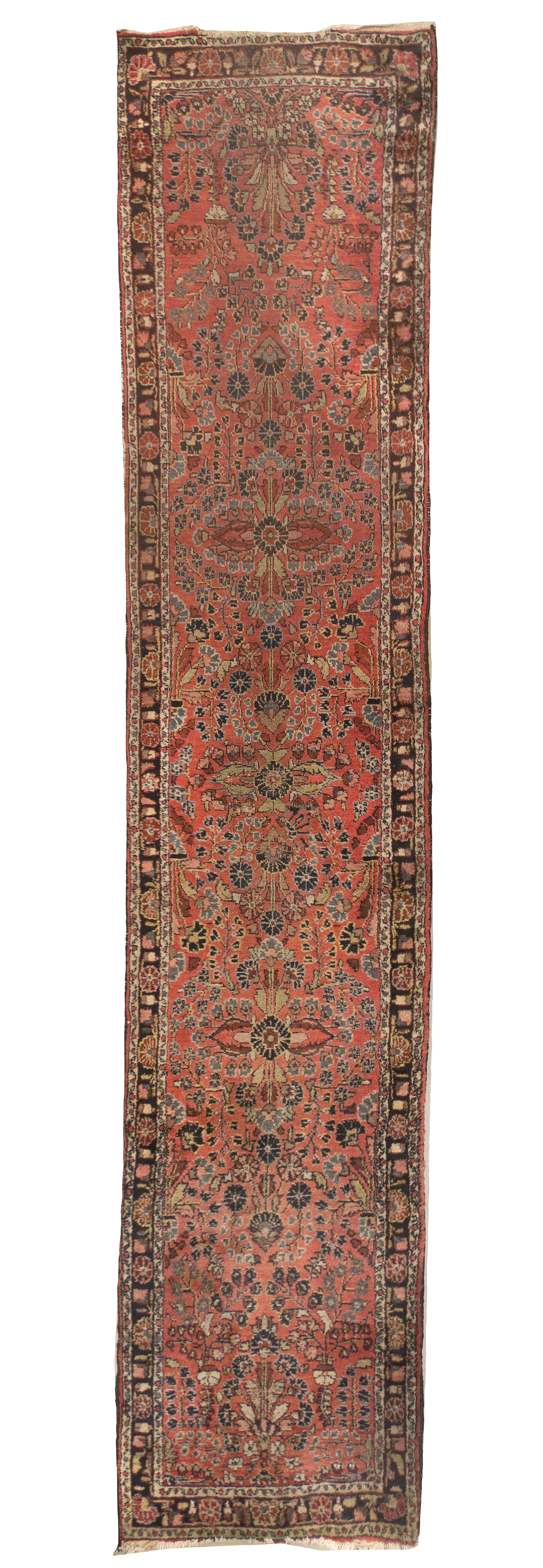 A Sarouk Wool Runner, 12 feet 4 inches x 2 feet 7 inches.