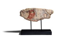 An Egyptian Painted Limestone Relief Fragment