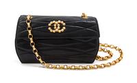 A Chanel Black Quilted Leather and Faux Pearl Flap Bag, 7 1/2 x 4 1/2 x 2 1/2 inches.