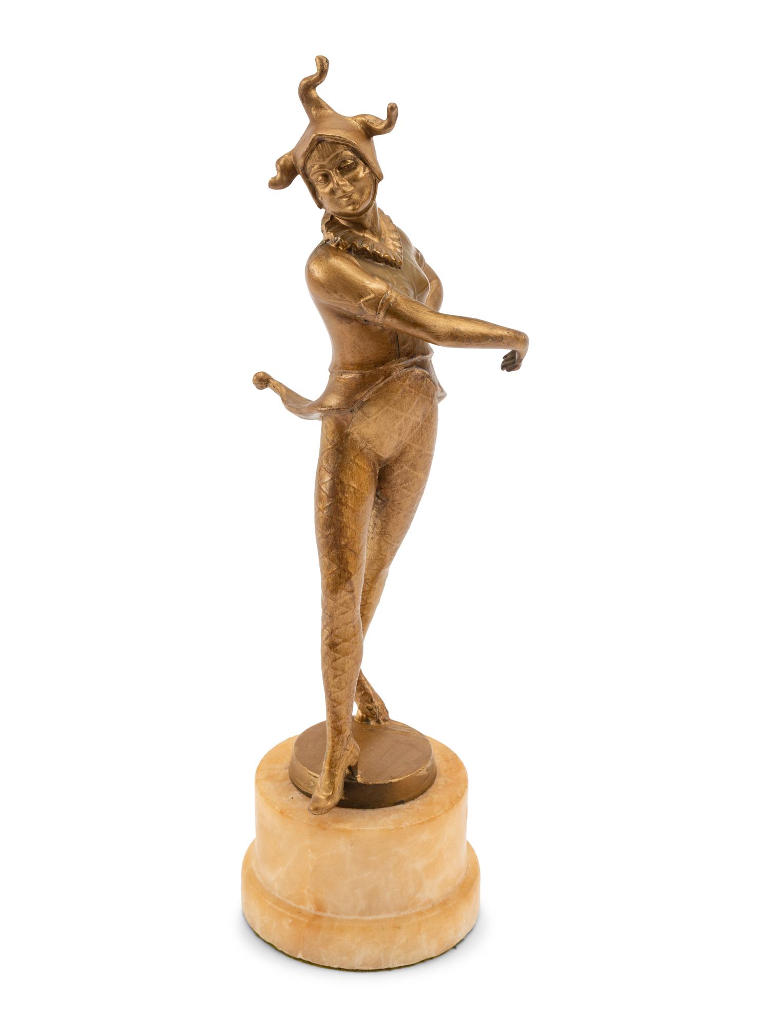 A French Gilt Bronze Figure of a Harlequin on an Onyx Base