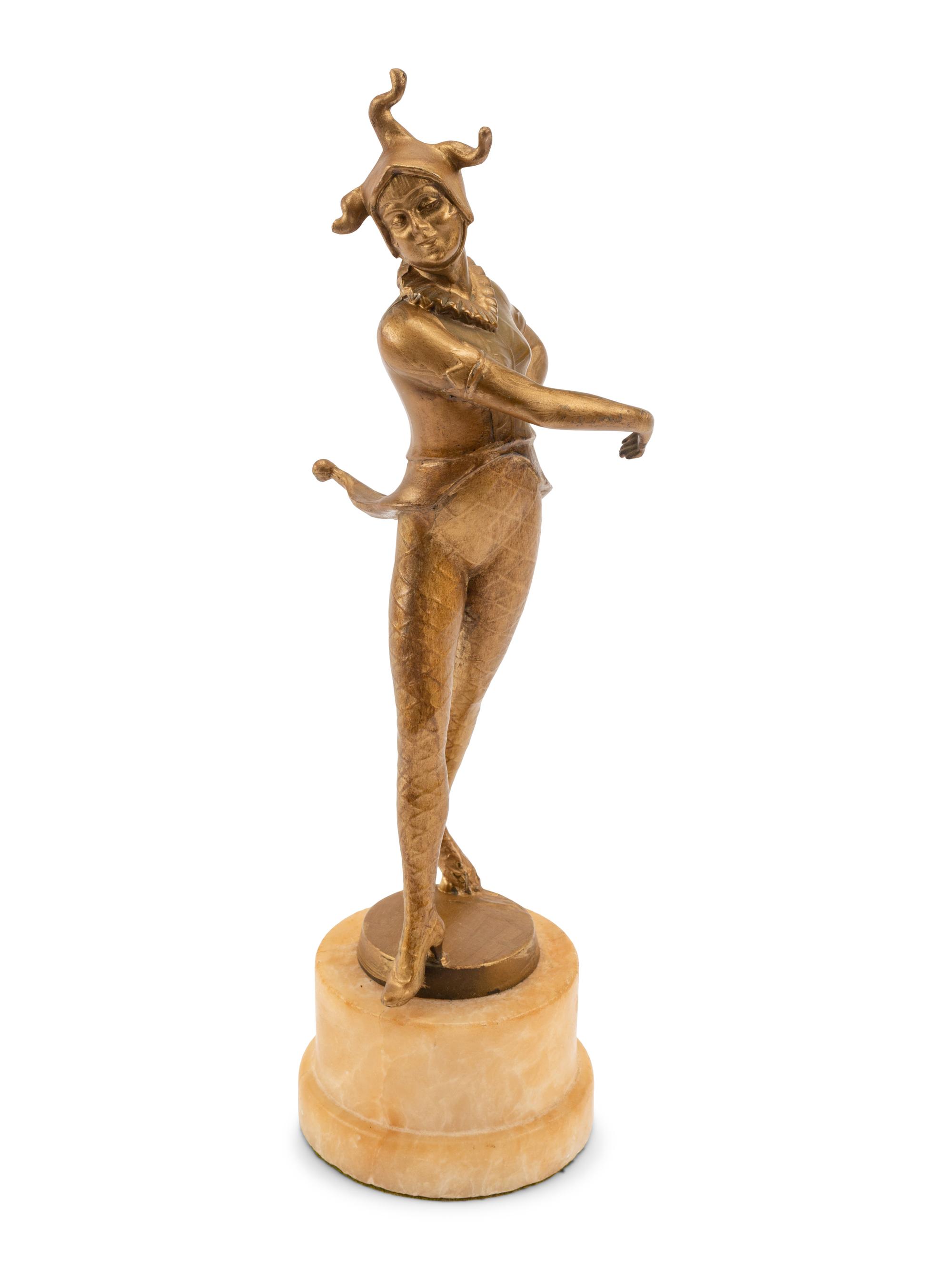 A French Gilt Bronze Figure of a Harlequin on an Onyx Base