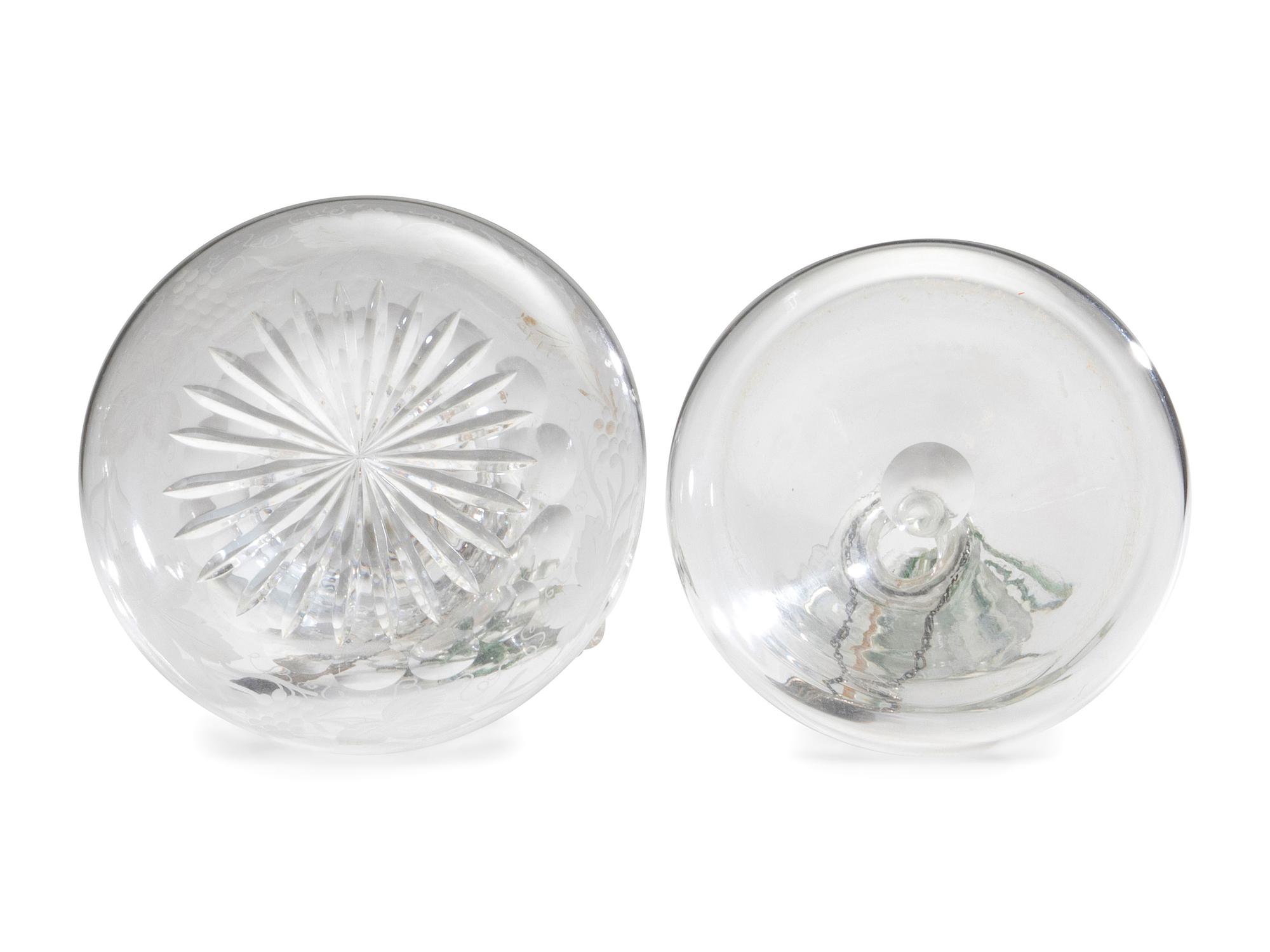 Fifteen Glass Decanters with English Shell-Form Silver Bottle Tags