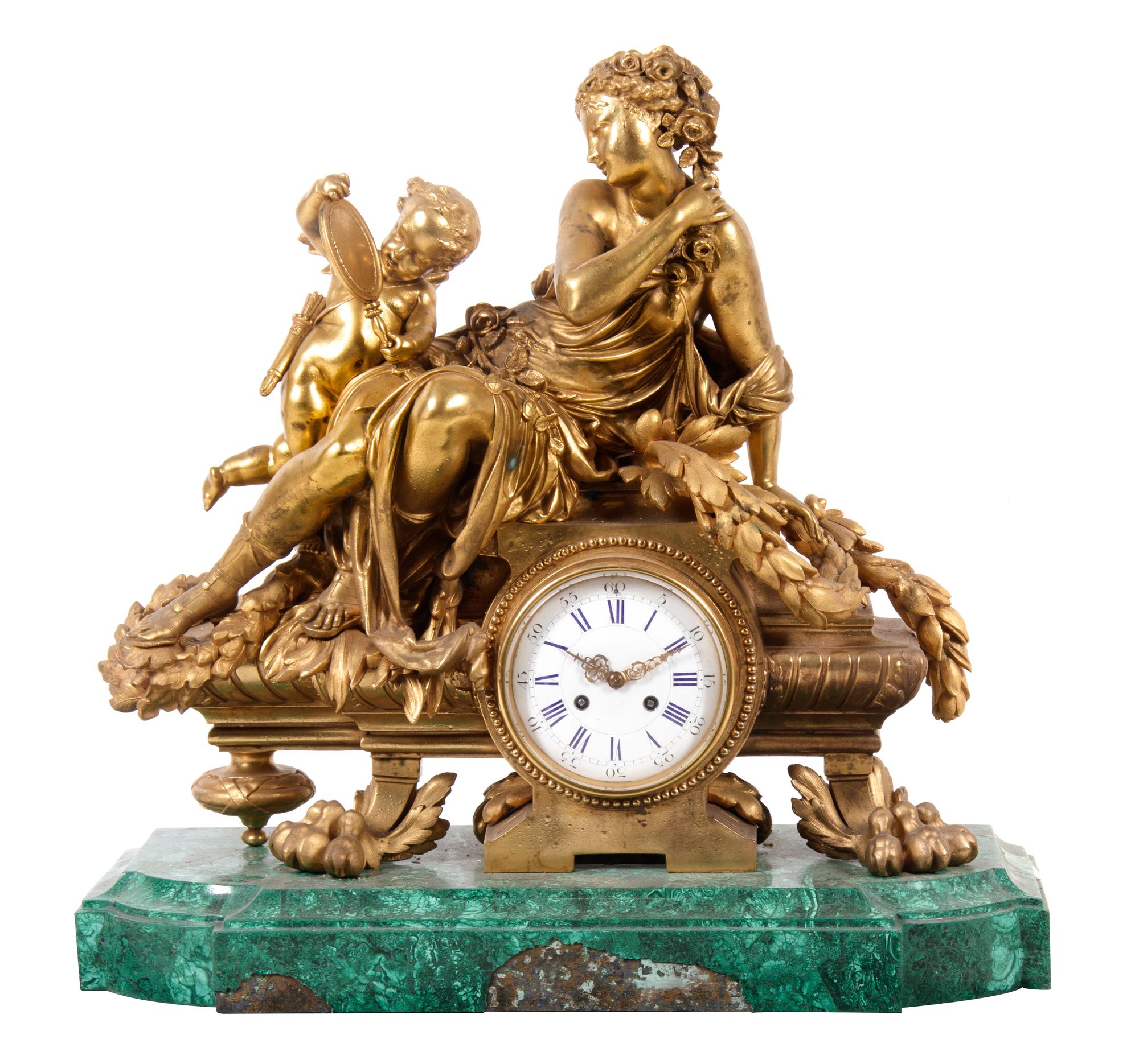 A Louis XV Style Gilt Metal Mounted Malachite Mantel Clock