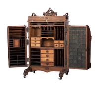 A Renaissance Revival Carved and Burl Walnut Wooton Desk