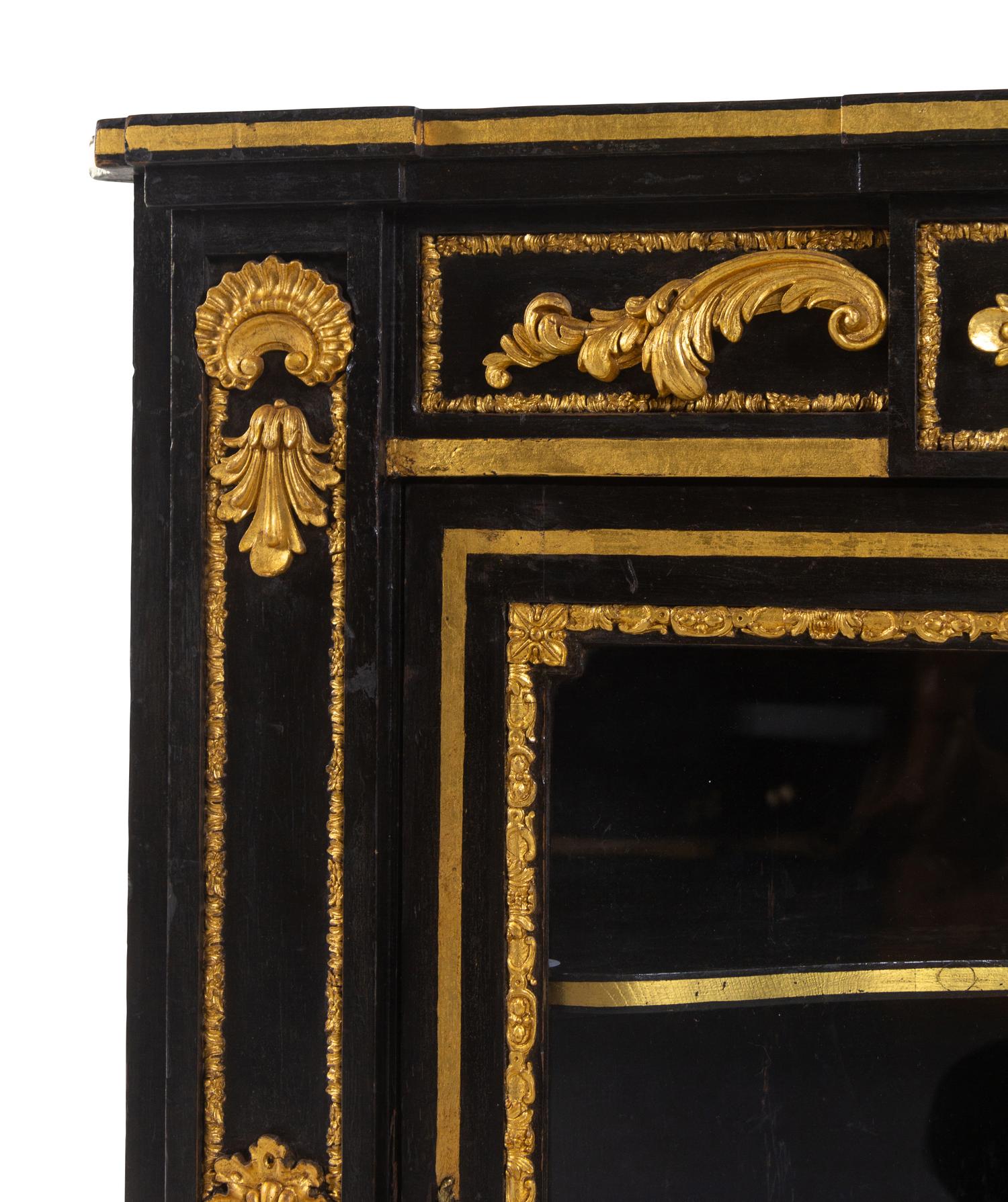 A Napoleon III Style Parcel Gilt and Ebonized Marble-Top Corner Cabinet