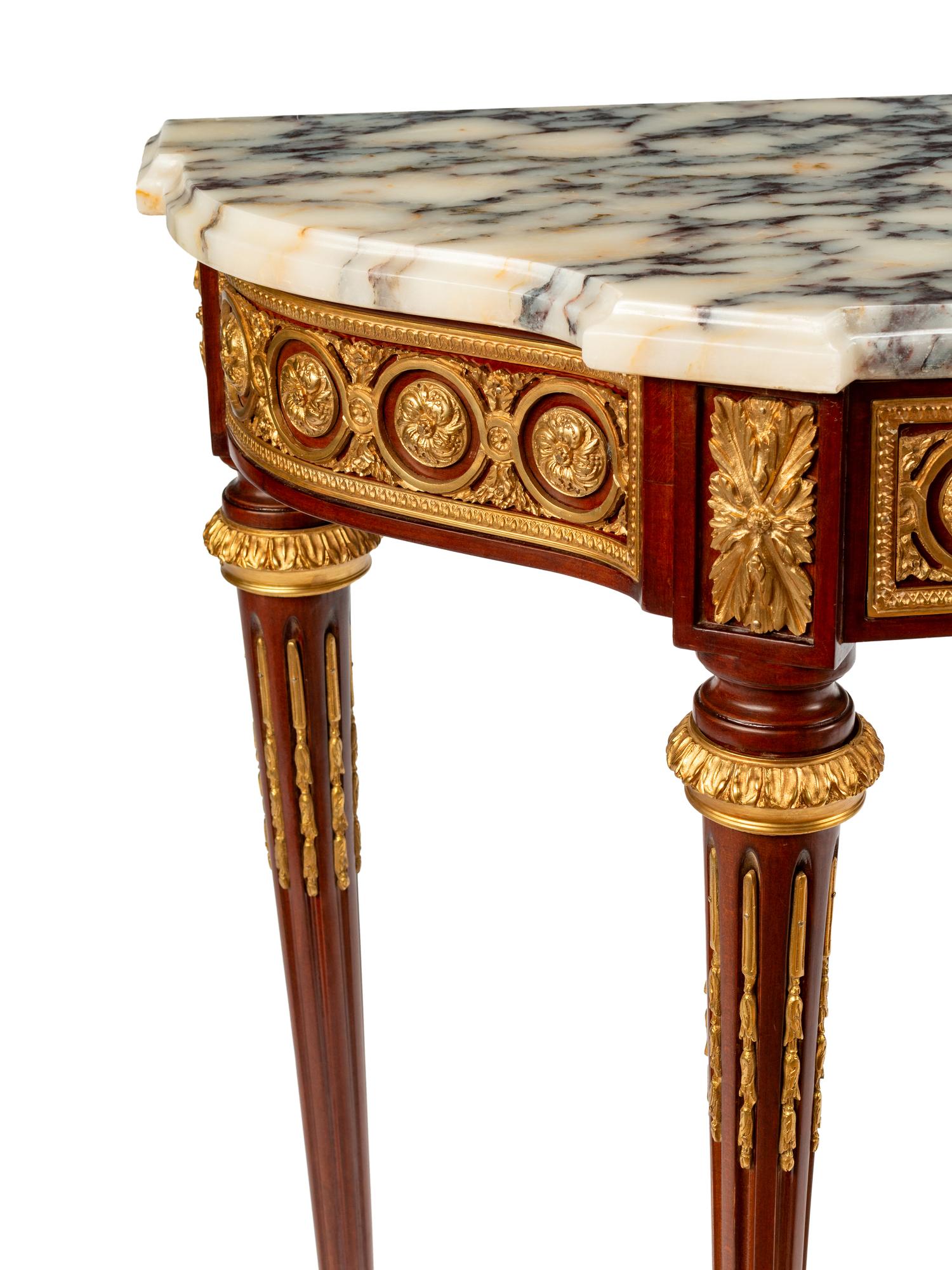 A Louis XVI Style Gilt Bronze Mounted Mahogany Marble-Top Console Table