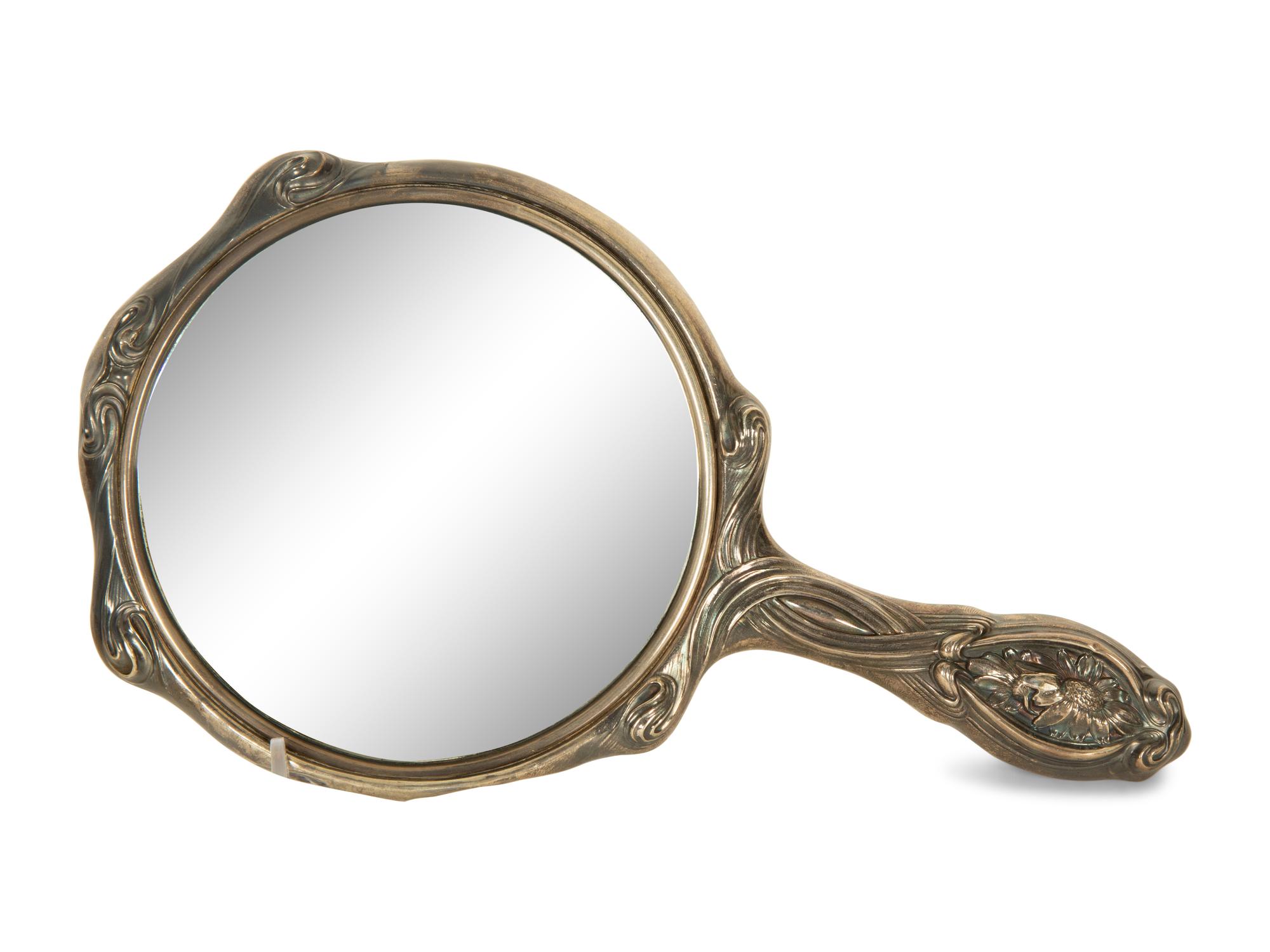 A Silver Hand Mirror and Hairbrush