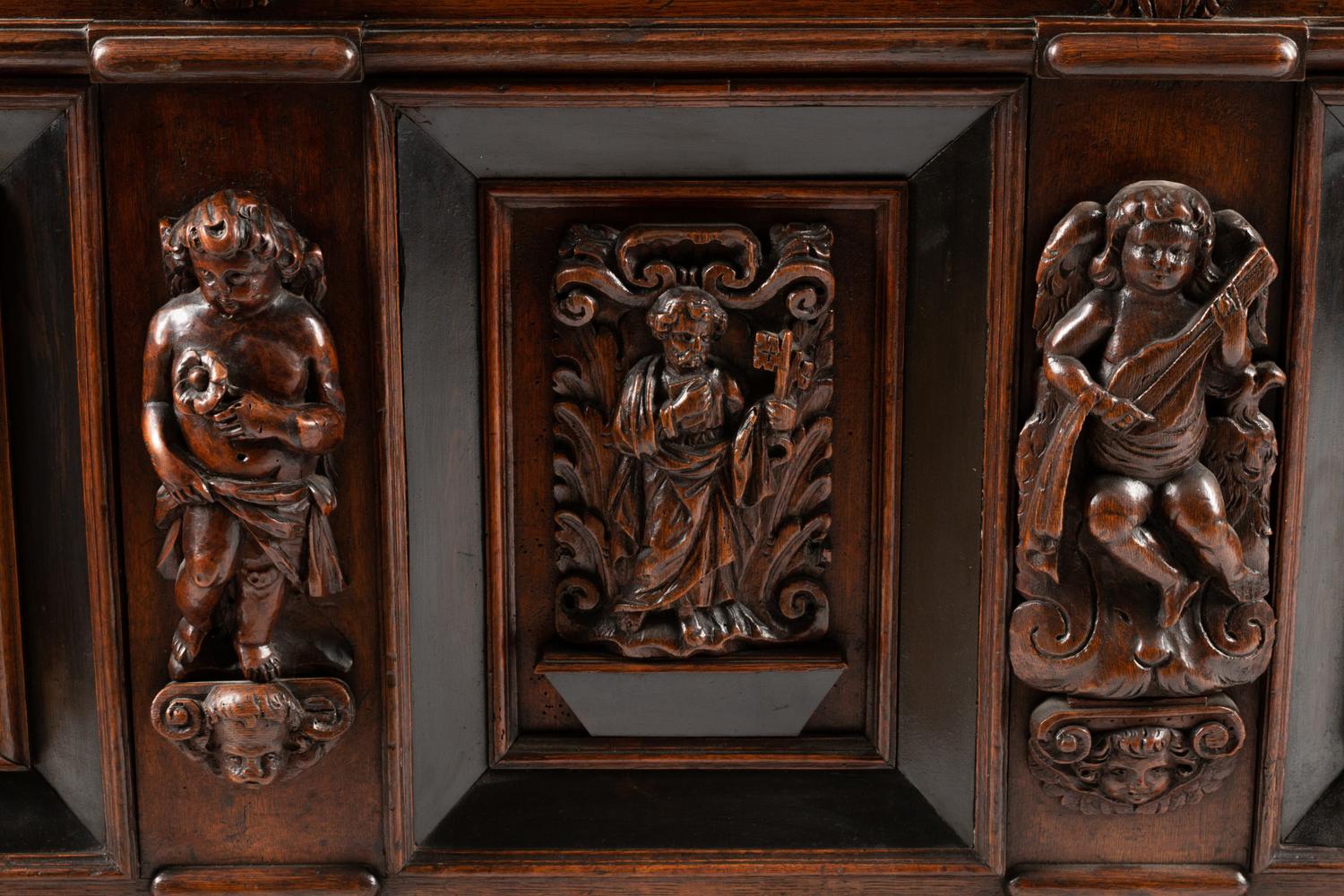 An Italian Carved Oak and Walnut Cassone