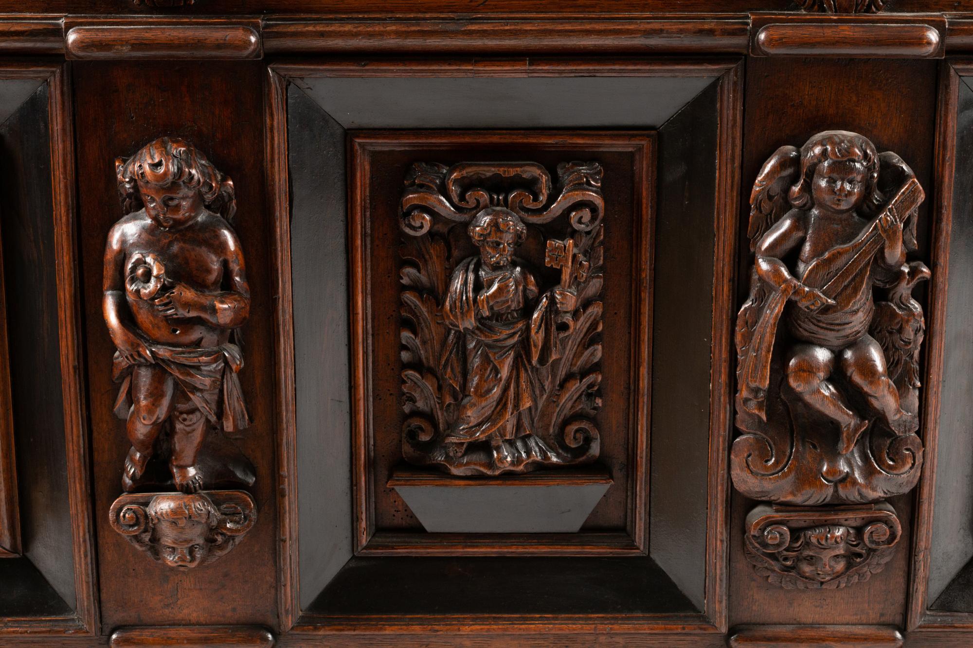 An Italian Carved Oak and Walnut Cassone