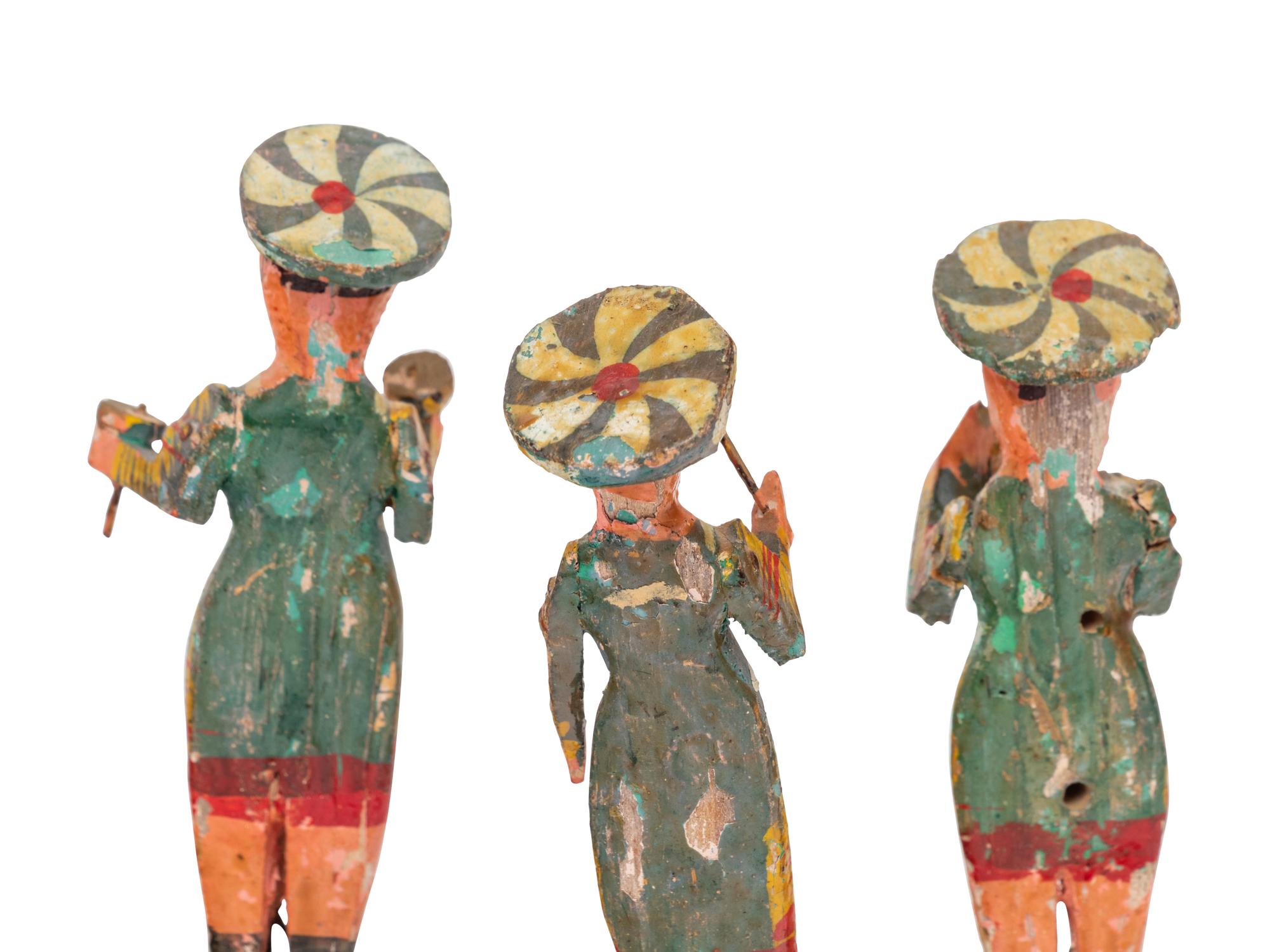 Eight Russian Polychromed Carved Wood Marchind Band Figures