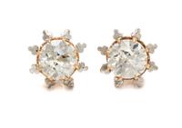 A Pair of Bicolor Gold and Diamond Stud Earrings, 2.90 dwts.
