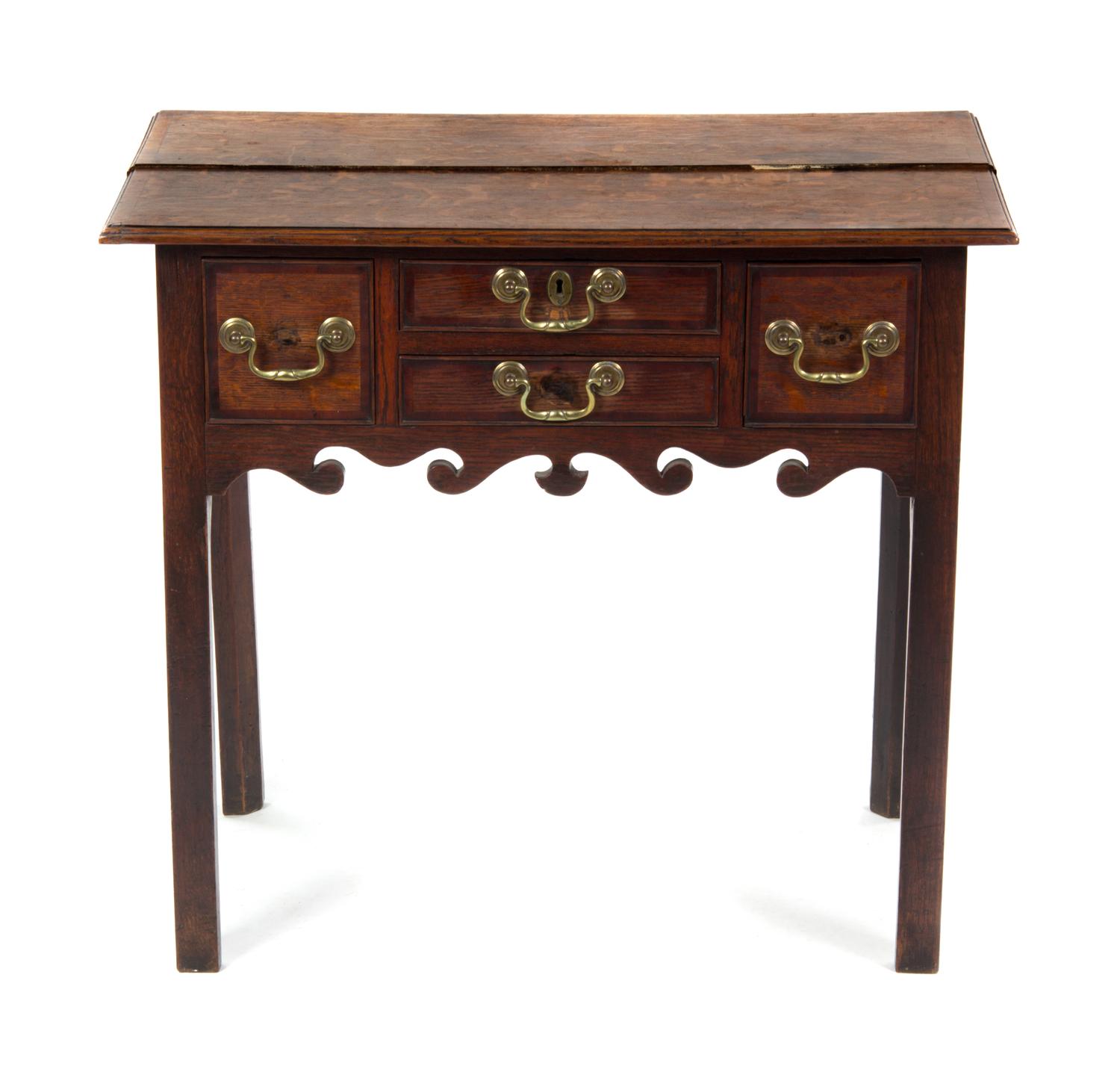 A George II Oak Lowboy, MID-18TH CENTURY, Height 28 1/2 x width 31 3/4 x depth 19 3/4 inches. — MID-18TH CENTURY,