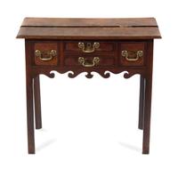 A George II Oak Lowboy, MID-18TH CENTURY, Height 28 1/2 x width 31 3/4 x depth 19 3/4 inches. — MID-18TH CENTURY,
