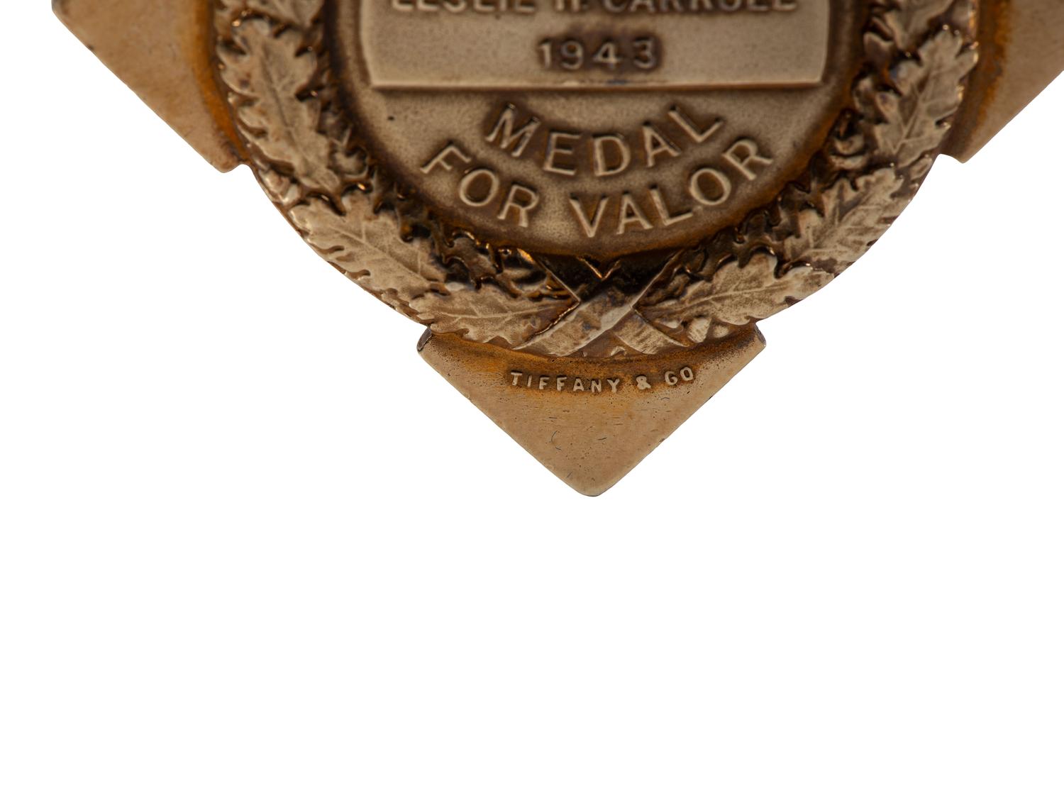 [OCCUPATIONAL]. National Surety Medal for Valor presented to African American police officer Leslie H. Carroll. New York: Tiffany & Co., 1943.