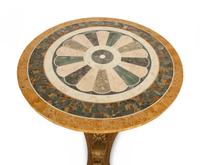 An Italian Design Pietra Dura Center Table with Carved Giltwood Dolphin Base