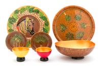 A Set of Hand Painted Mahogany Charger, Plates and Bowls by Bibi Leon, Dominican Republic Diameter of chargers 13 3/4 inches. — 20TH CENTURY