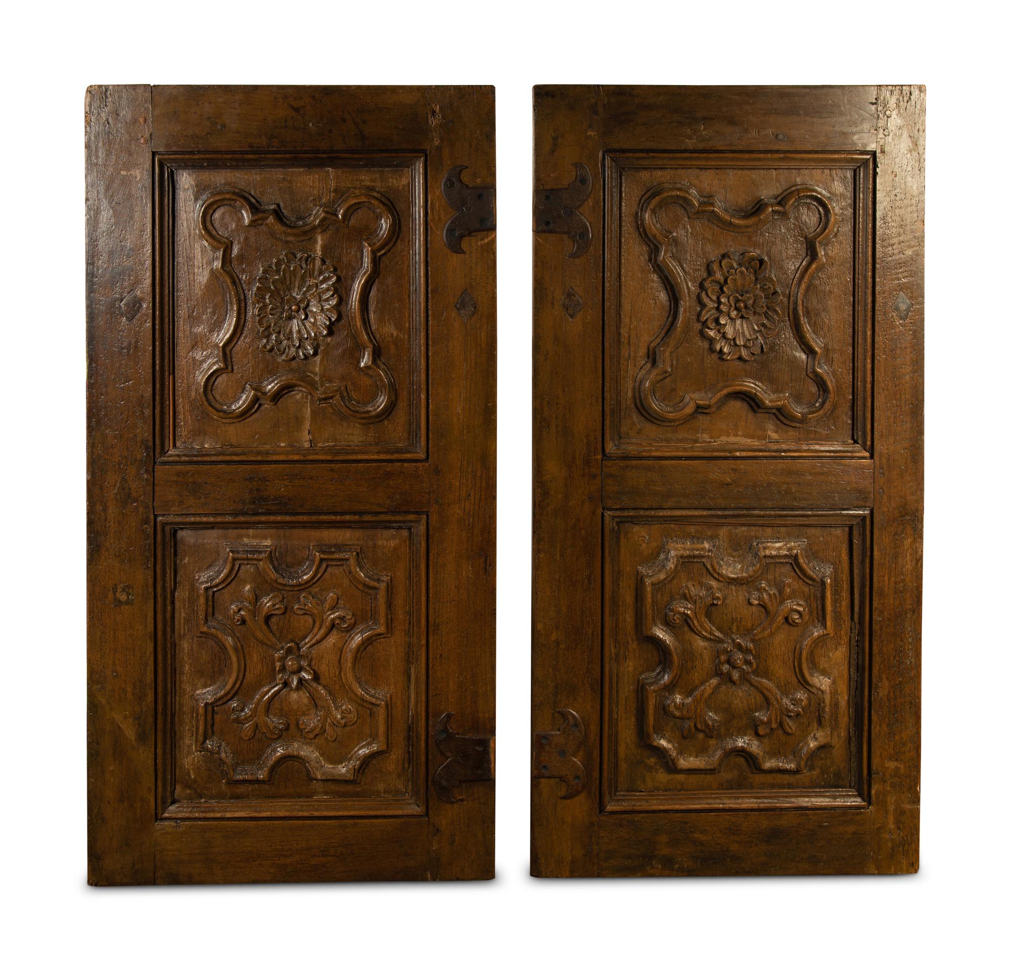A Pair of Italian Carved Walnut Wall Panels