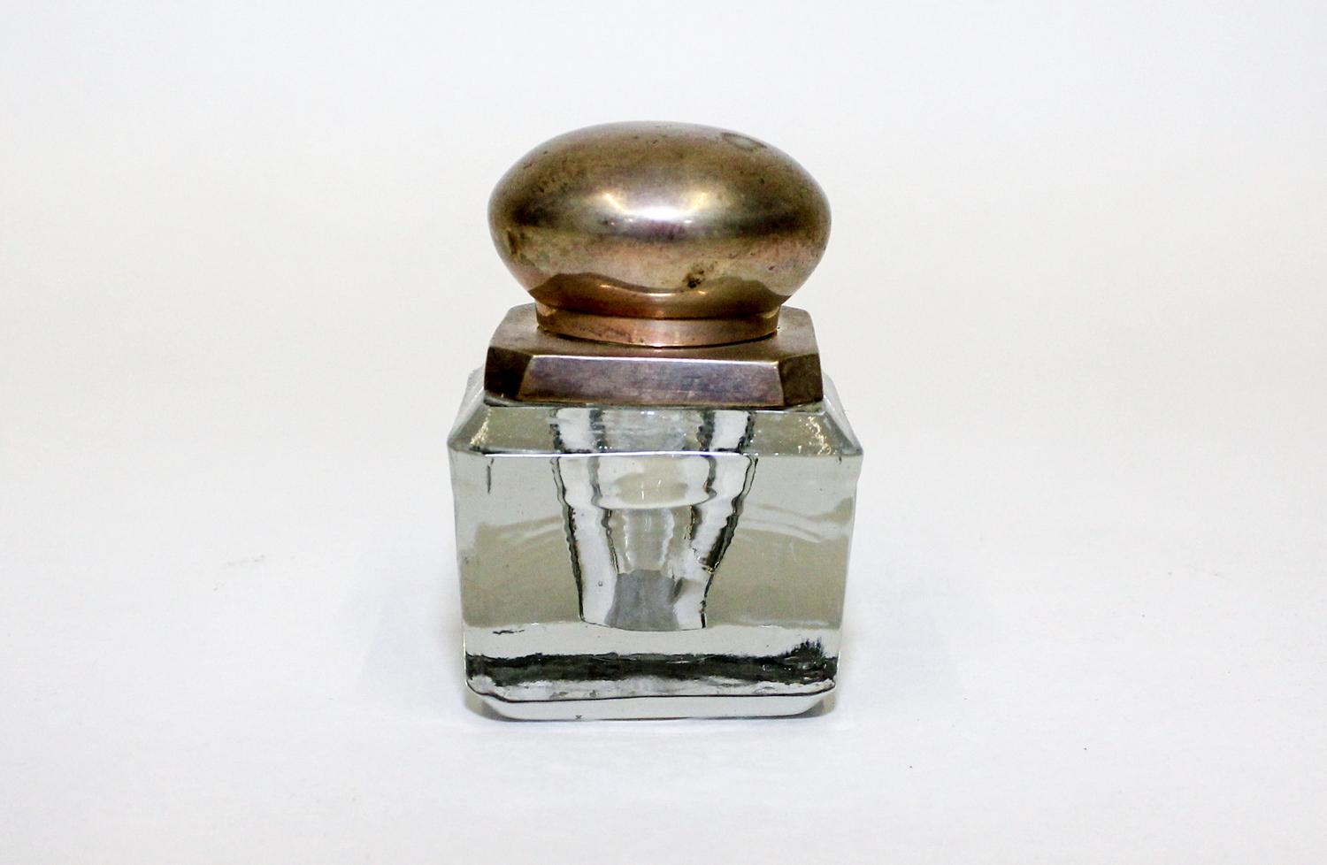 A Glass Inkwell. Height 3 inches.