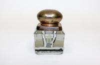 A Glass Inkwell. Height 3 inches.