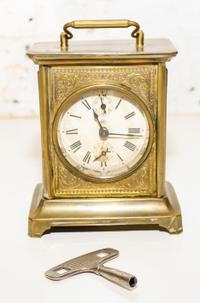 A Seth Thomas Brass and Slag Glass Carriage Clock. Height 6 inches.