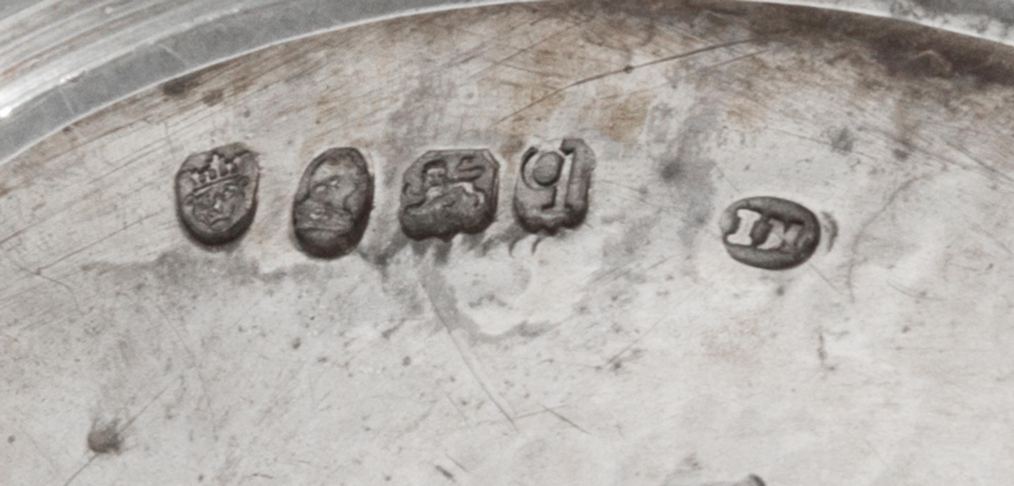 A George III Silver Sugar Basket, James Mince, London, 1791, having a swing handle, an engraved foliate band at the upper rim and ermin