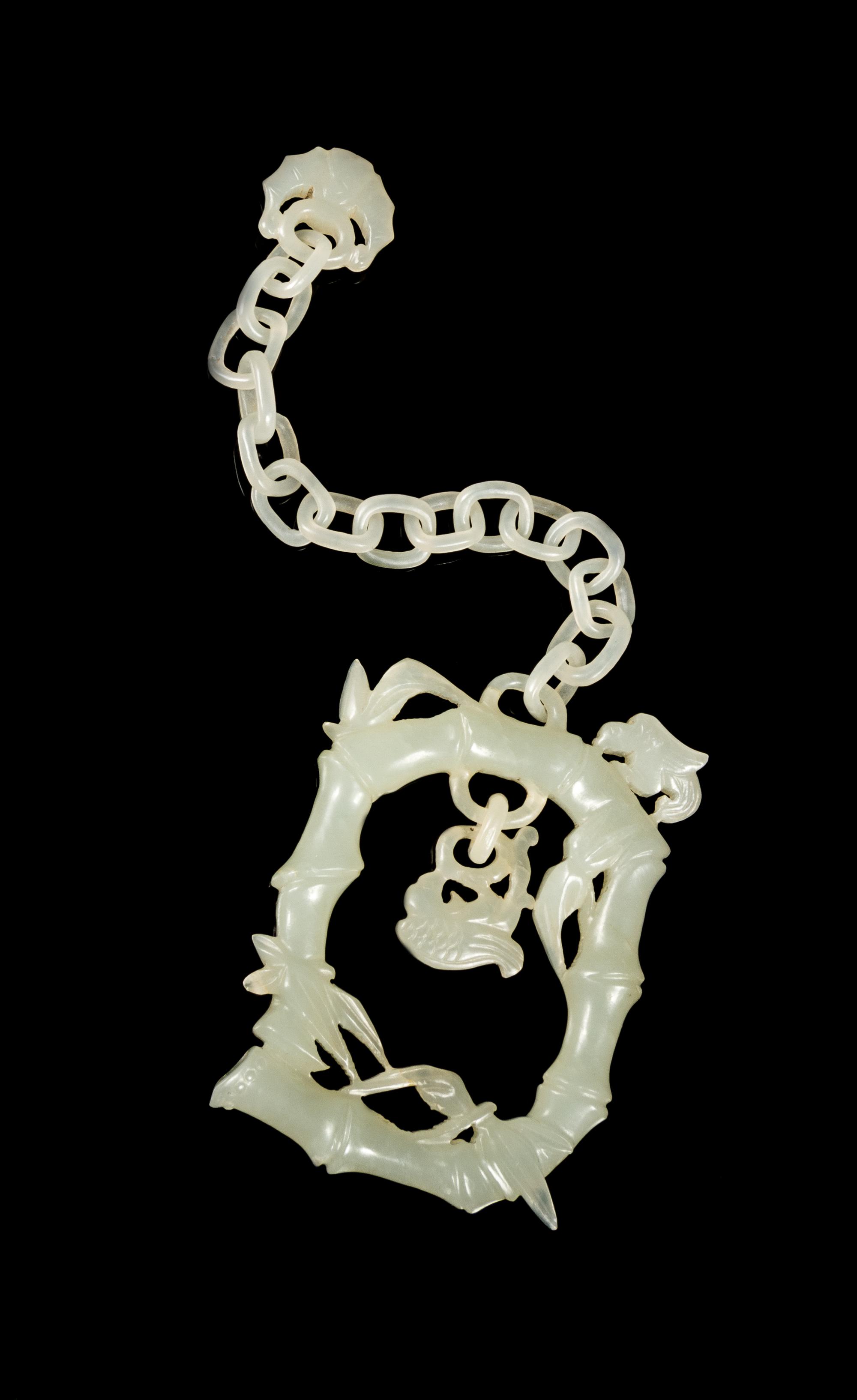A Pale Celadon Jade 'Bamboo' Hanging Pendant Length overall 6 1/2 inches. — 19TH CENTURY