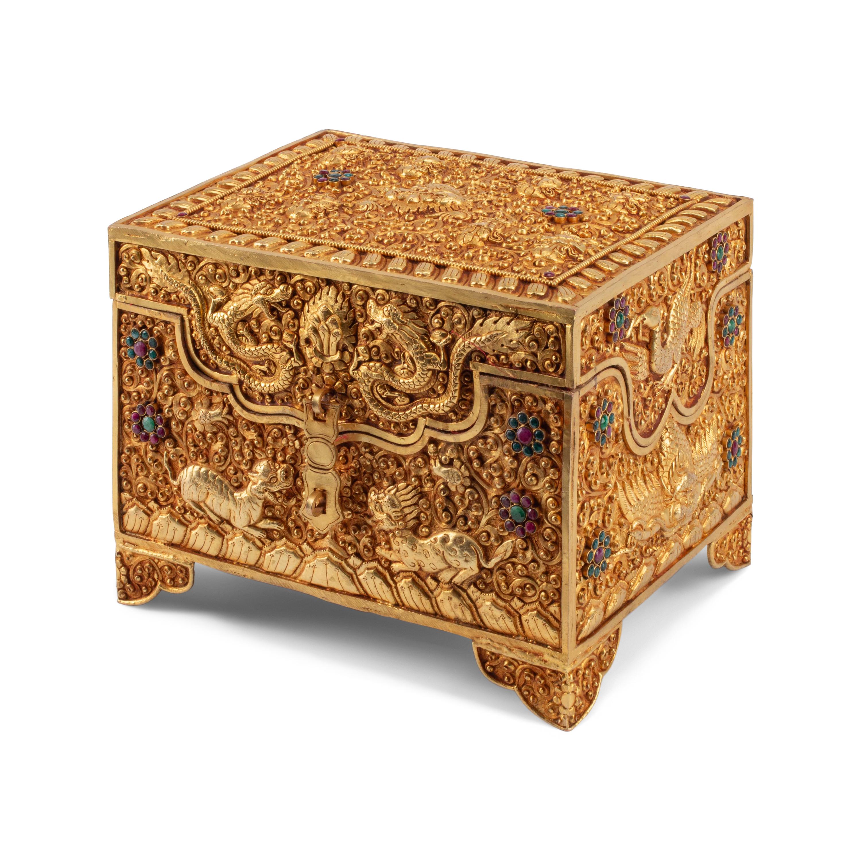 A Tibetan Style Gilt Metal, Emerald and Ruby Mounted Table Casket