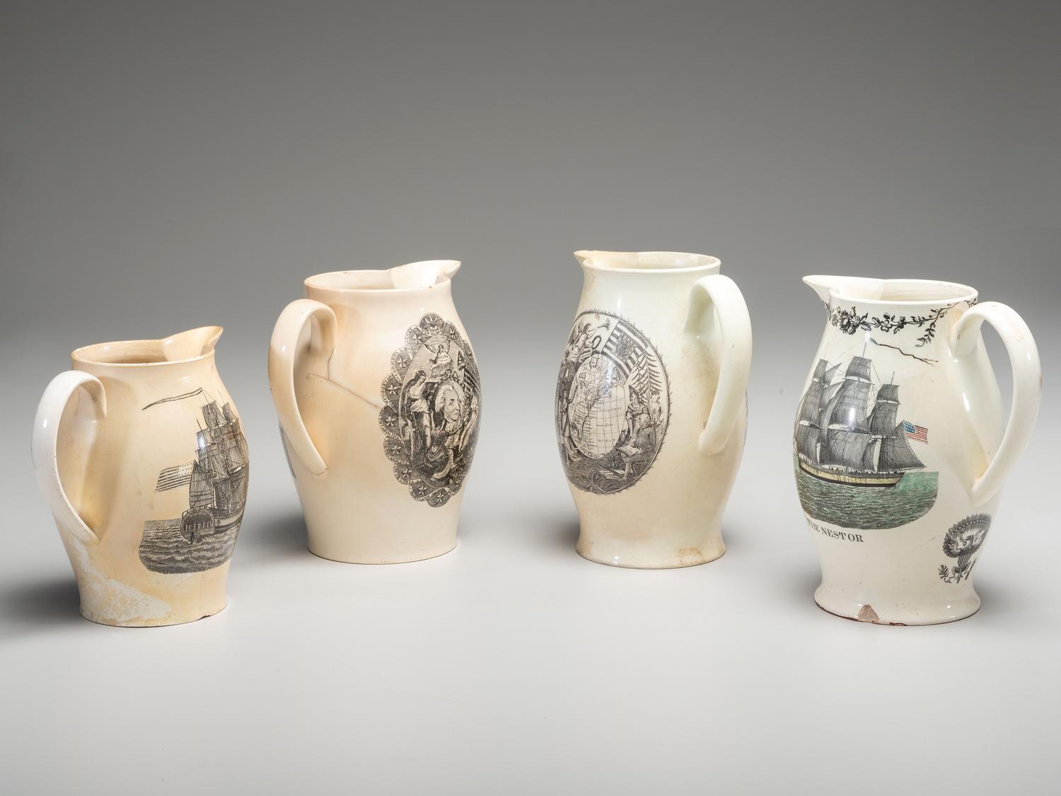 A Wedgwood Britannia and Etruria Panel and Nautical Creamware Pitchers