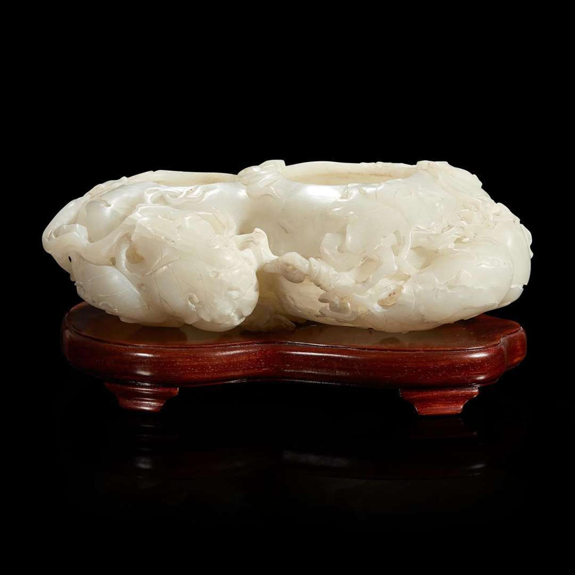 A Chinese carved white jade double-gourd washer with wood stand