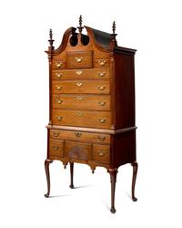 A Queen Anne Carved Walnut Bonnet-Top High Chest of Drawers