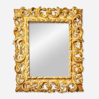 An elaborate Italian carved giltwood mirror 18th / 19th century