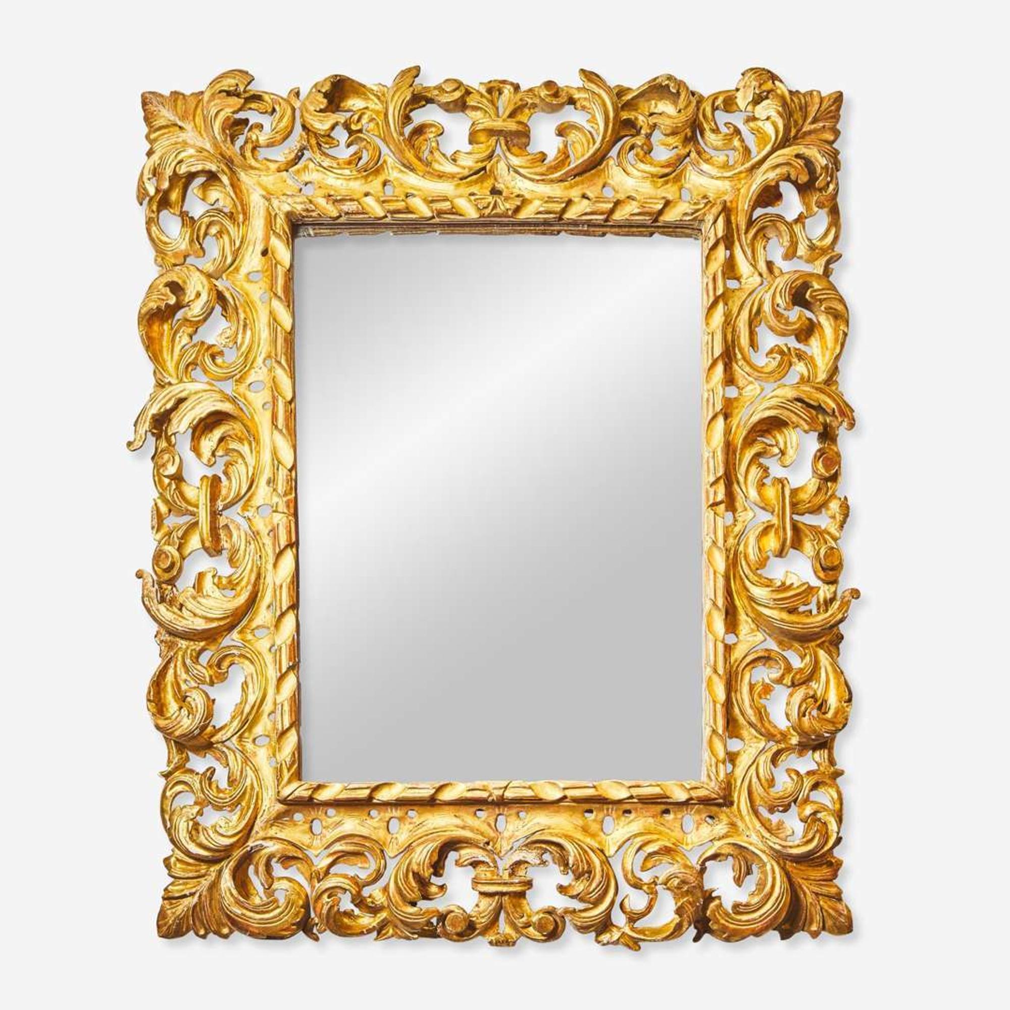 An elaborate Italian carved giltwood mirror 18th / 19th century