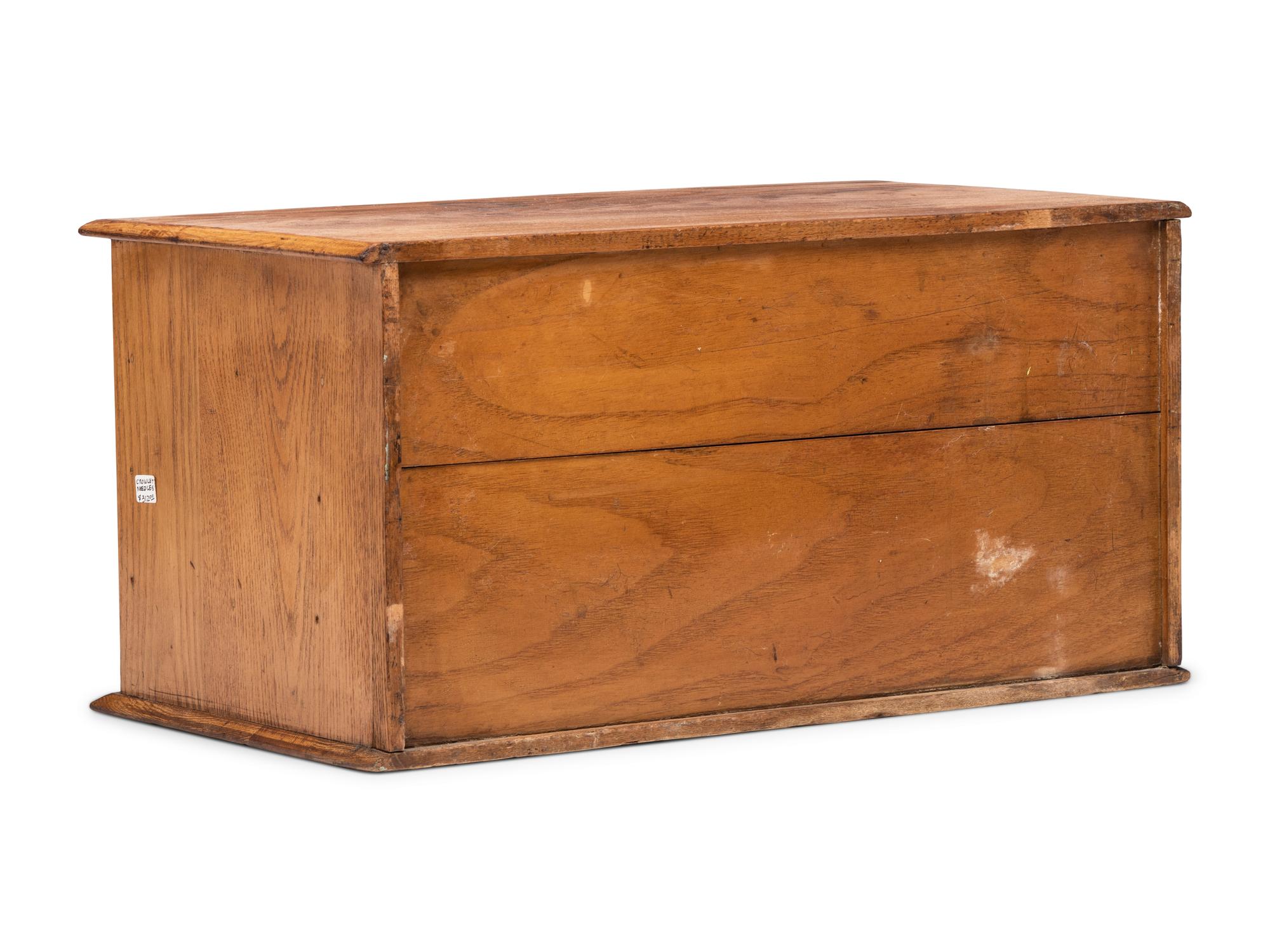 A Twelve Drawer Crowley's Needles Advertising Cabinet