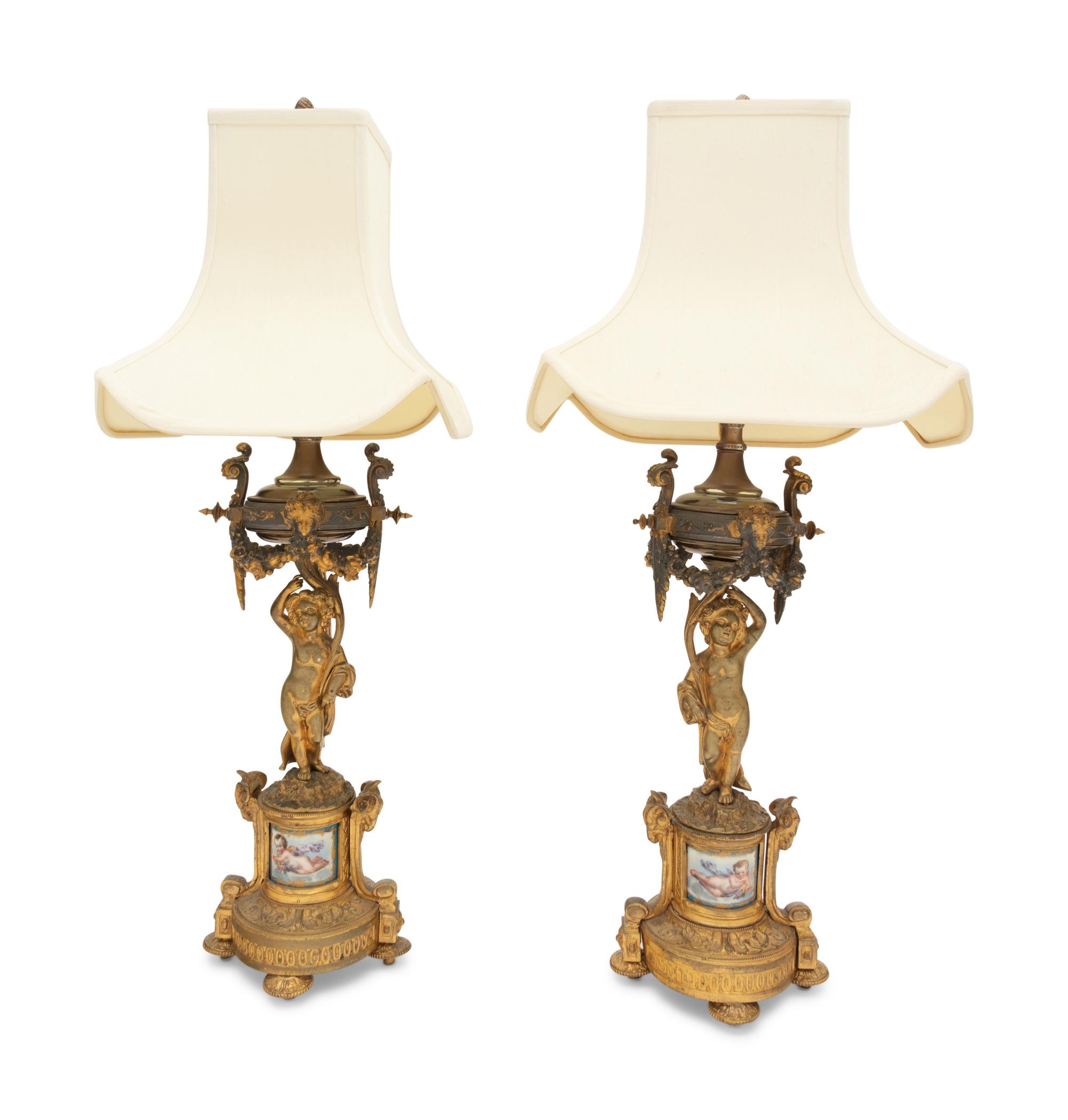 A Pair of French Porcelain Mounted Gilt Bronze Figural Lamps