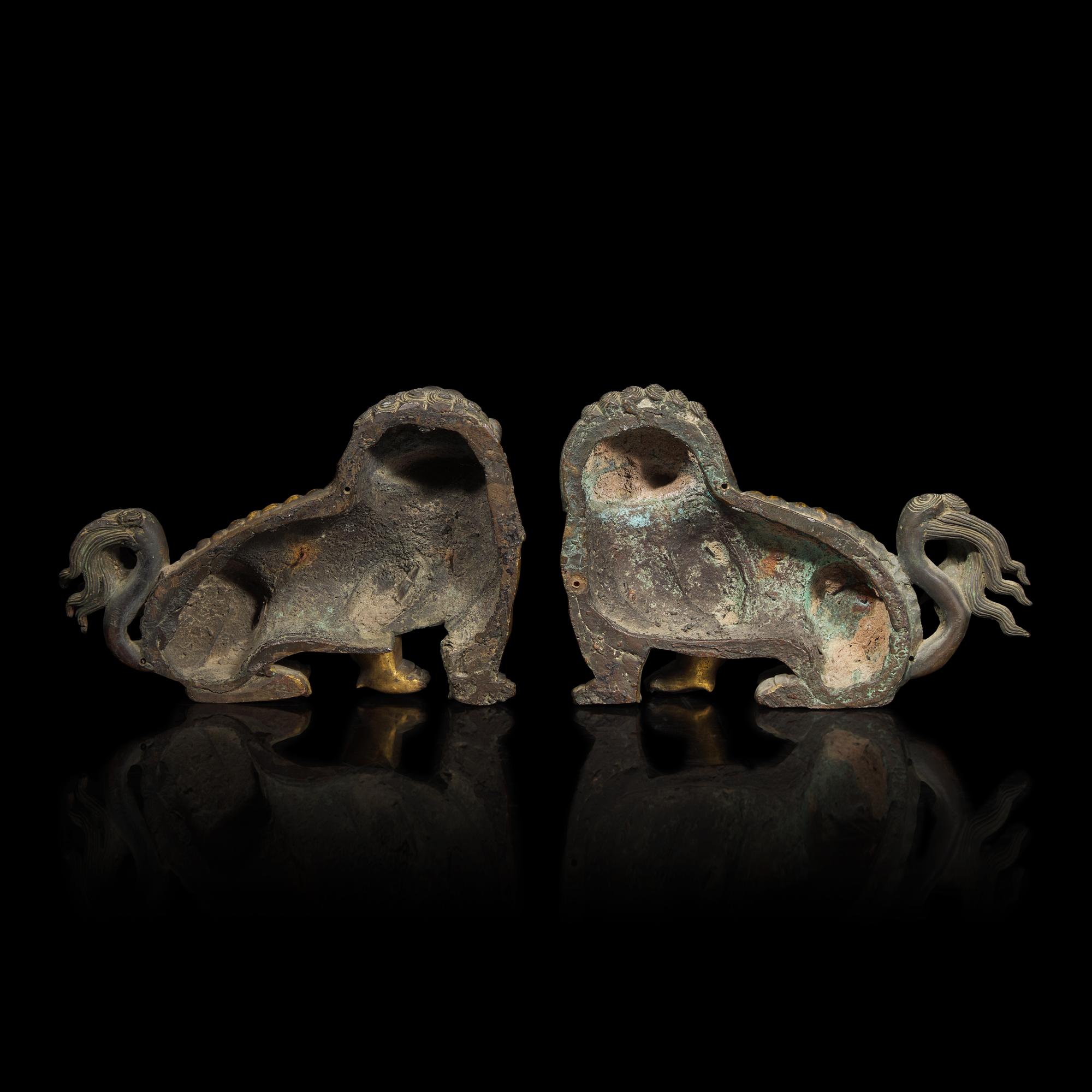 A Pair of Chinese Gilt Bronze Lion Mounts, 17th/18th Century 清中期 鎏金銅獅一對