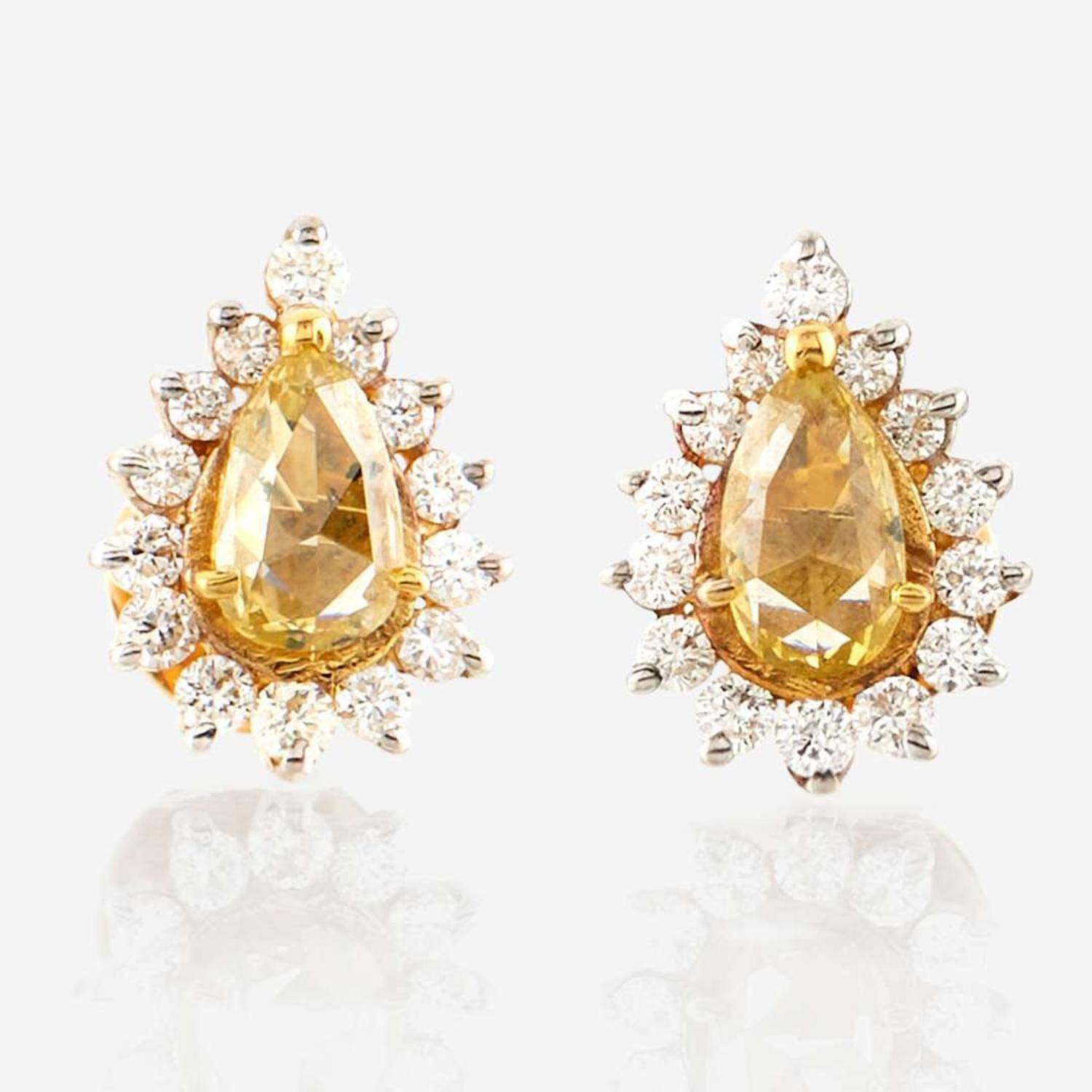 A pair of colored diamond, diamond, and gold earrings