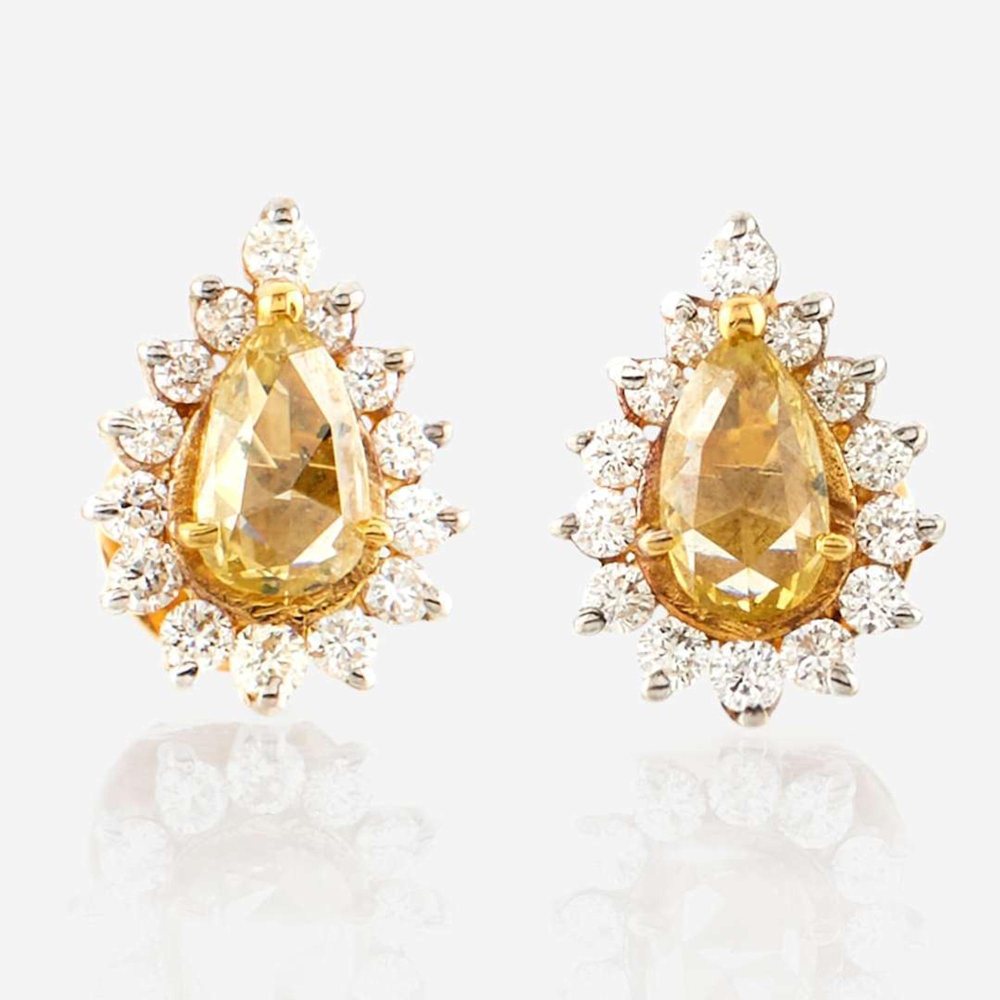 A pair of colored diamond, diamond, and gold earrings