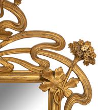 A Continental Art Nouveau Giltwood Mirror